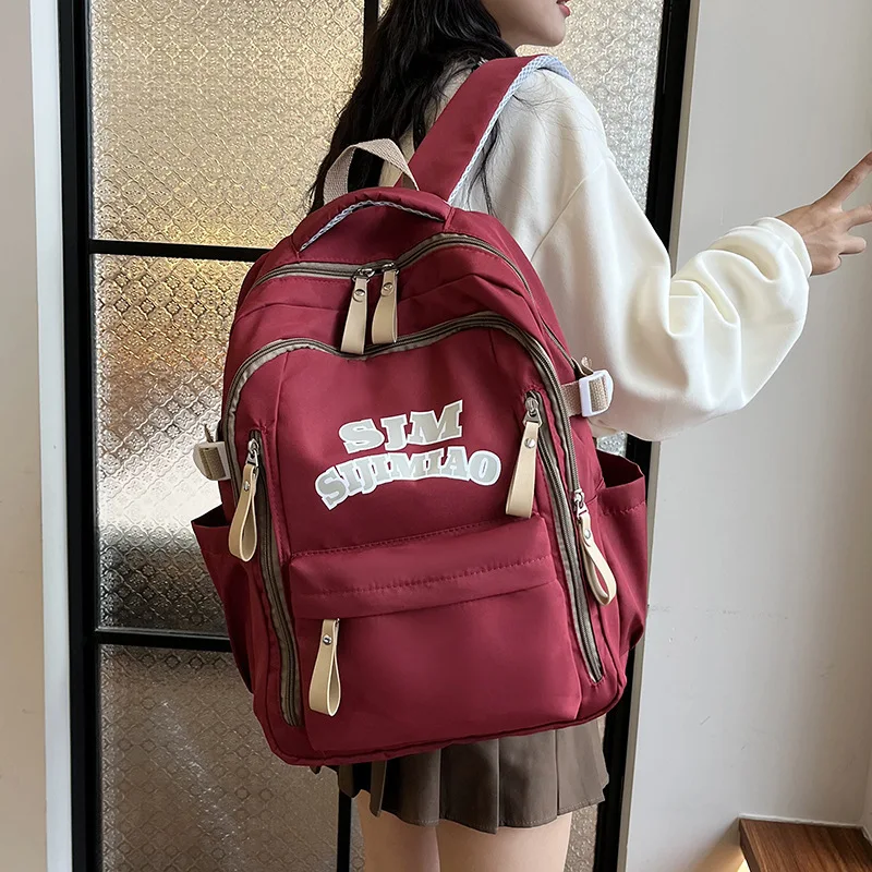 

Large Capacity Students Backpack Girls Casual Waterproof Nylon School Bag Women Fashion Travel College Bag Letter Shoulder Bag