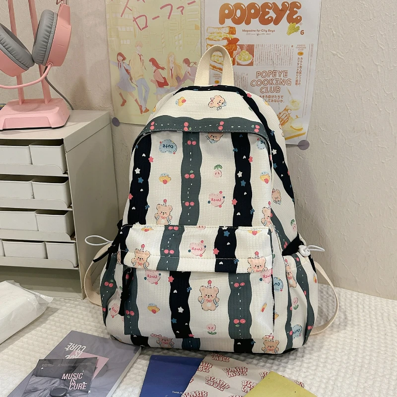 جديد لطيف الكرتون على ظهره المرأة سعة كبيرة حقيبة مدرسية موضة طباعة حقائب الظهر مريحة ومتعددة الاستخدامات الملمس حقيبة المدرب