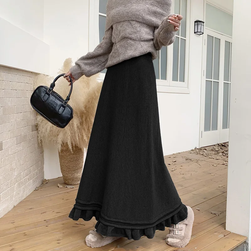 2025 한국 버전 가을 겨울 신축성 있는 허리 플리츠 스커트 하프 스커트 슬림 스커트 페어리 솔리드 심플 오피스 니트 A라인