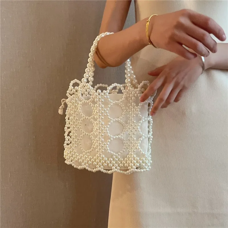 

Летняя трендовая дизайнерская женская сумка ручной работы с жемчужными бусинами, ажурная, в богемном стиле, пляжная, с внутренним карманом на шнурке