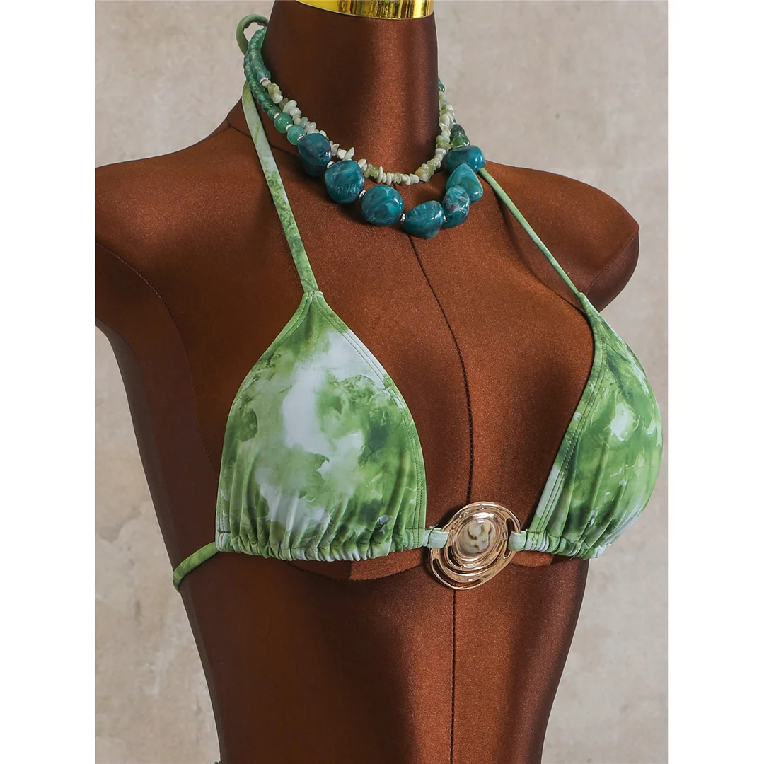 green bikini top with ring detail and halter straps