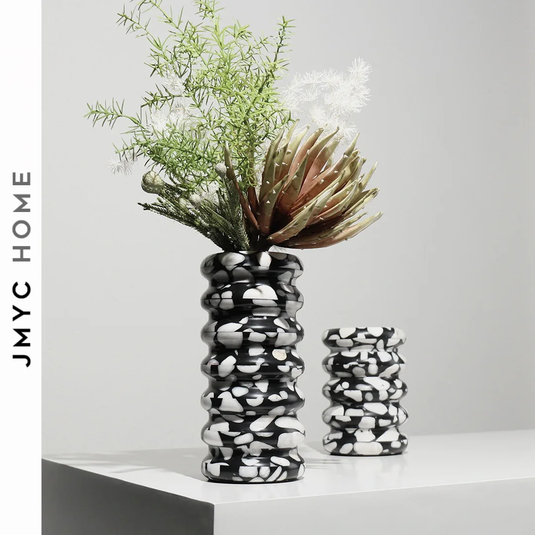 

Layered marble vase like living room tabletop flower arrangement with simple decoration