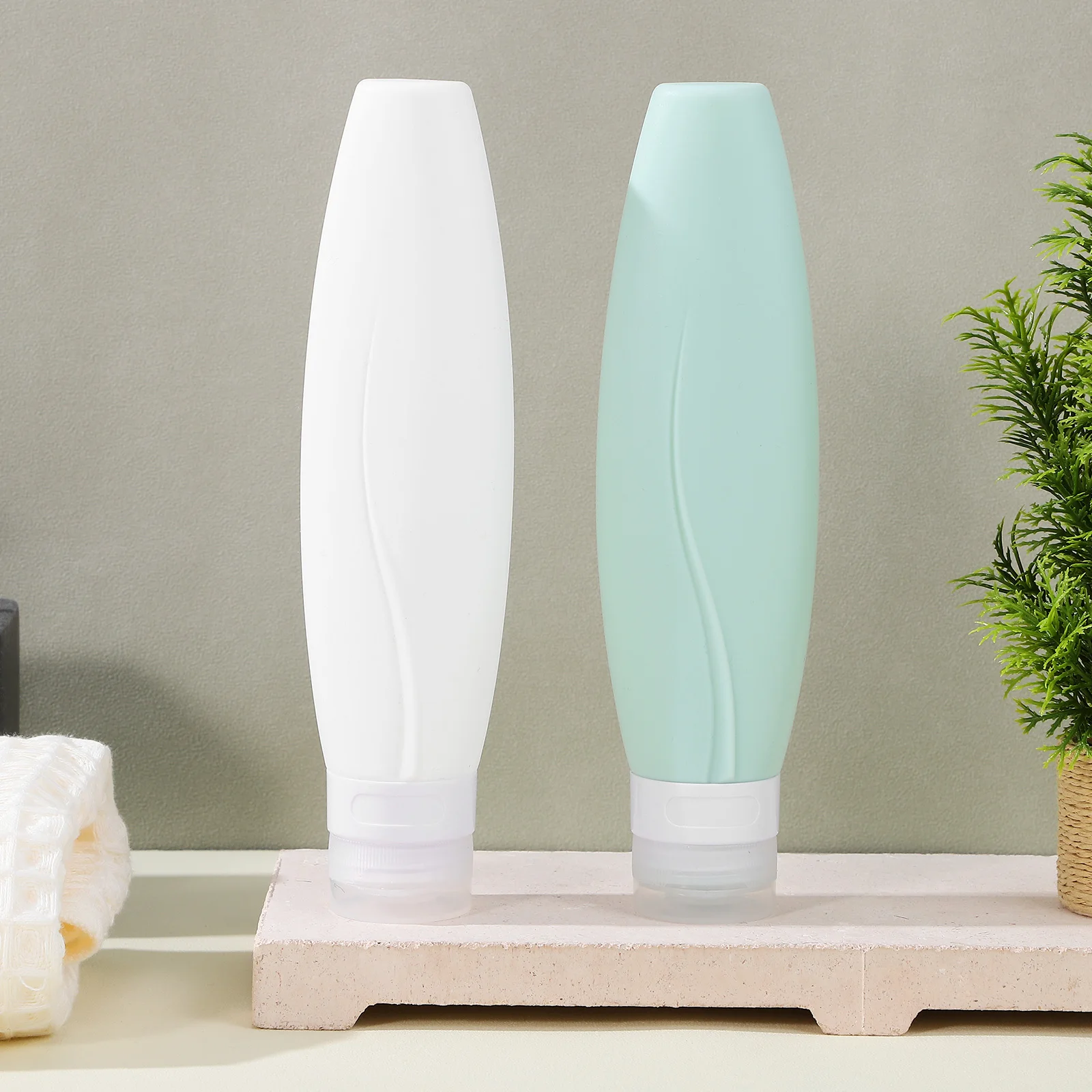 

2Pcs Mini Lotion Bottles Silicone Travel Containers 150ml for Shampoo Conditioner Body Wash Reusable Portable Stylish Design