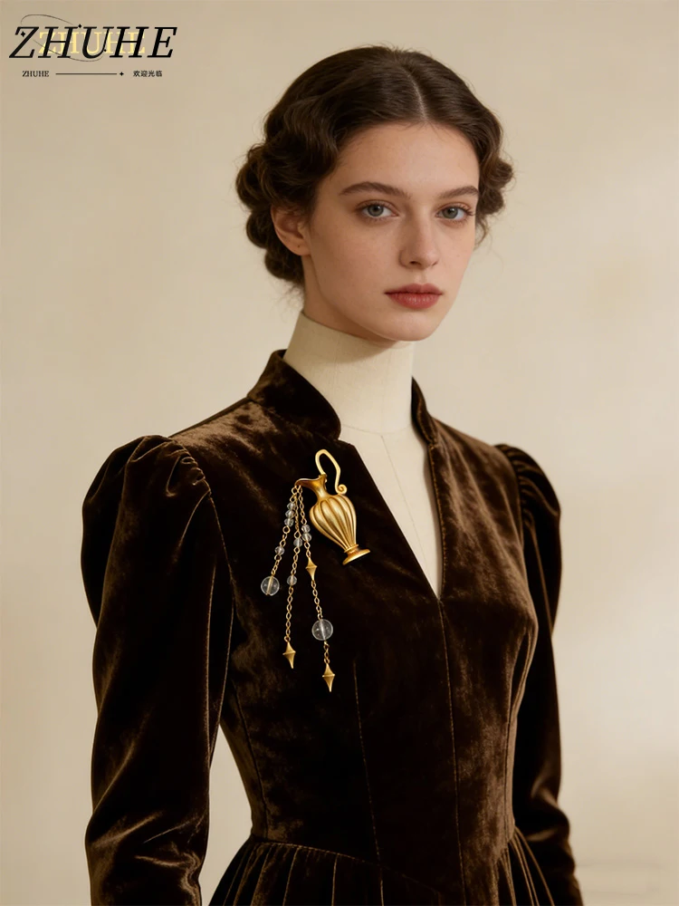 

Timeless Copper Amphora Brooch, Chic Jewelry Accessories For Men And Women, Detailed Fluted Body, Shimmering Crystal Tassel Drop