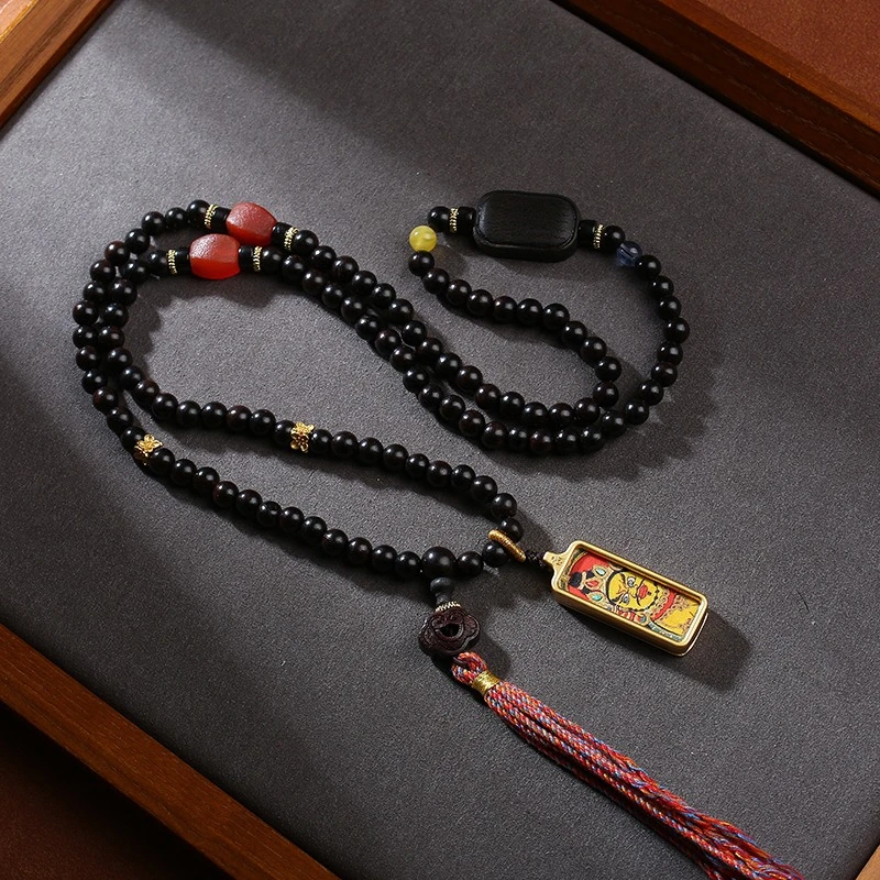 Tibetan Yellow God of Wealth Tangka Pendant with Handcrafted Ethnic Style Cultural Pendant in Black Sandalwood