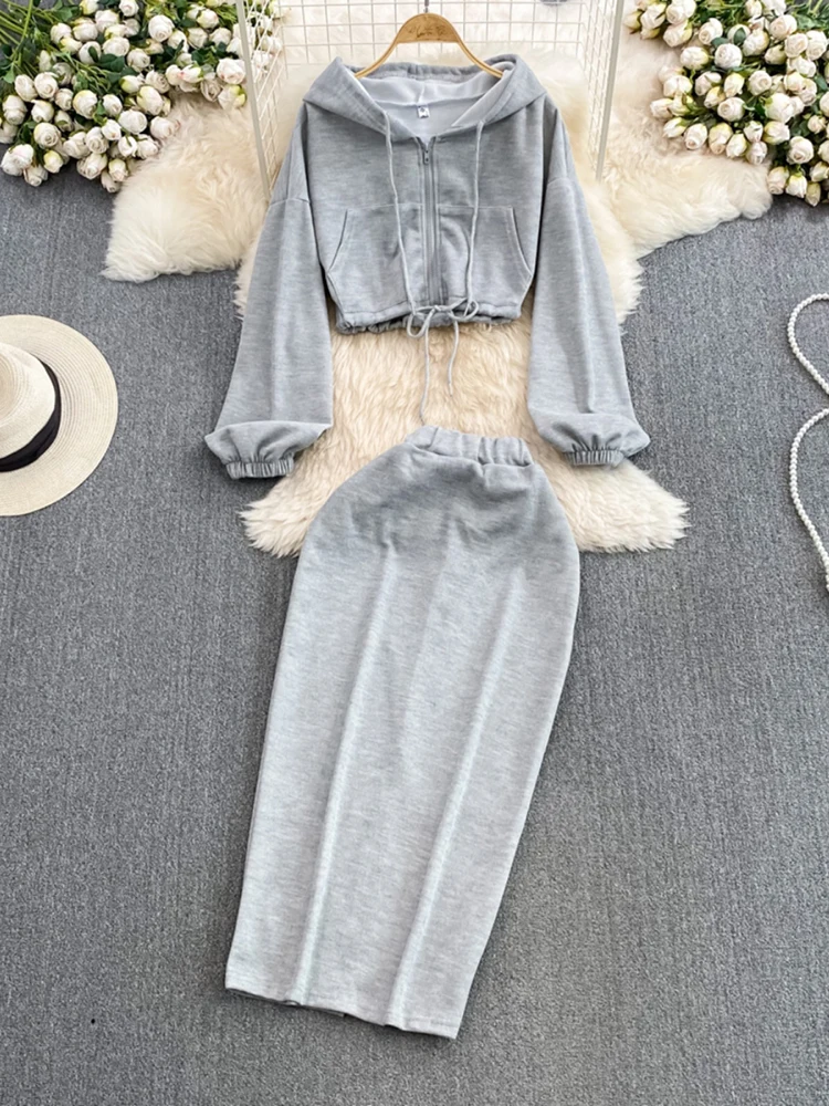 Moda versão coreana com zíper moletom com capuz cintura alta emagrecimento comprimento médio quadril abraçando saia simples elegante conjunto de 2 peças