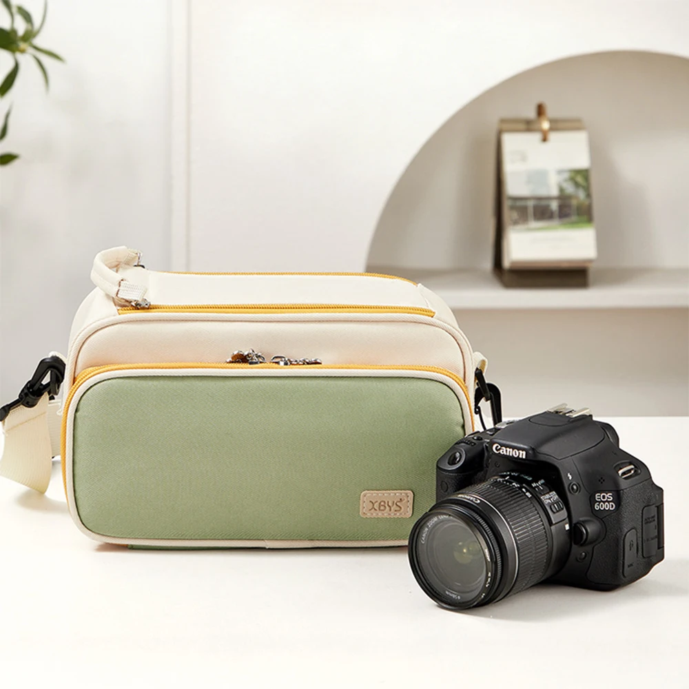 Camera storage bag with contrasting color design, including a bag for storing photographic equipment, messenger bag, and cross-b