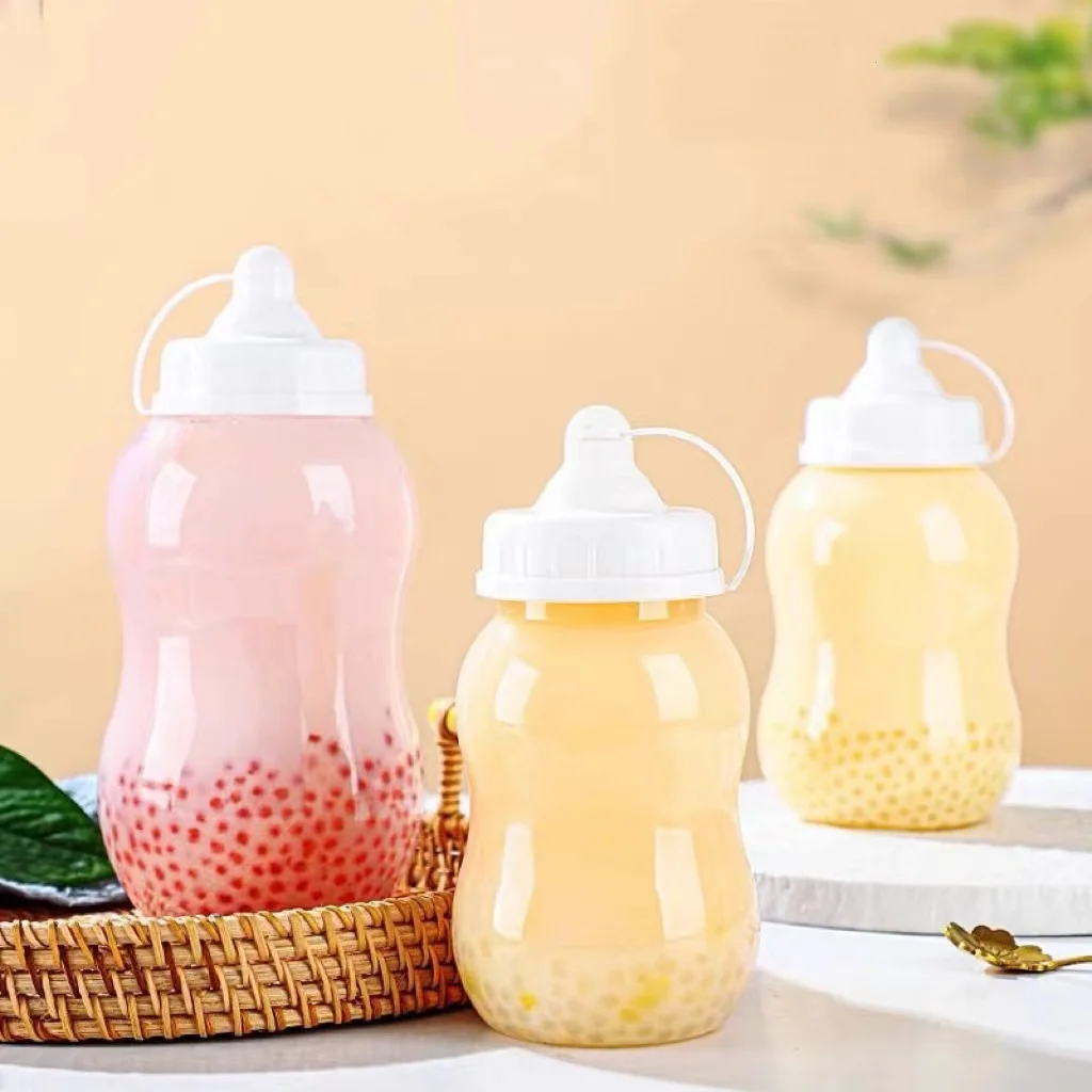 

Disposable Plastic Milk Tea Cup Juice Bottle with Lid Cute Kawaii Pacifier Baby Bottle Creative Transparent PET Ice Drinks Flask