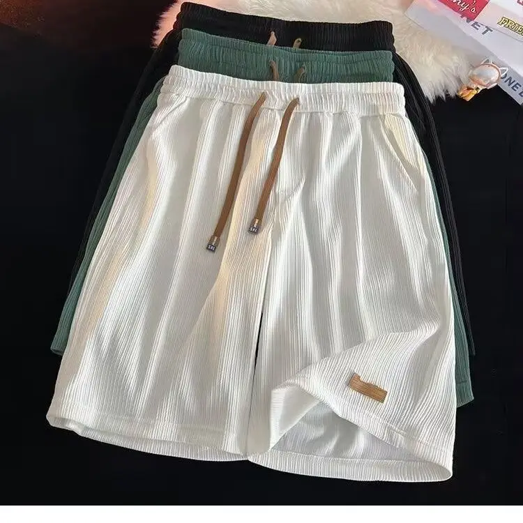 

Повседневные мужские летние ультратонкие свободные пляжные брюки из ледяного шелка, гонконгские студенческие спортивные брюки с вышитым логотипом, пять четвертей...