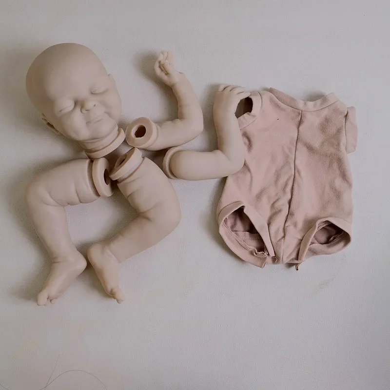 Zestaw dla lalek Reborn NPK 19'' Olivia, niezamalowana, świeży kolor, z tkaninowym ciałem i oczami, wysokiej jakości części do samodzielnego wykonania lalek.