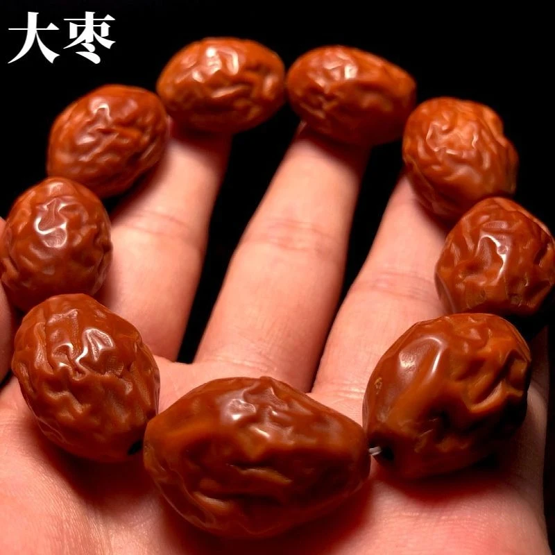 

Red and olive pit bracelet for men, high-end date seed beads, plain carved hand-held cultural artifact