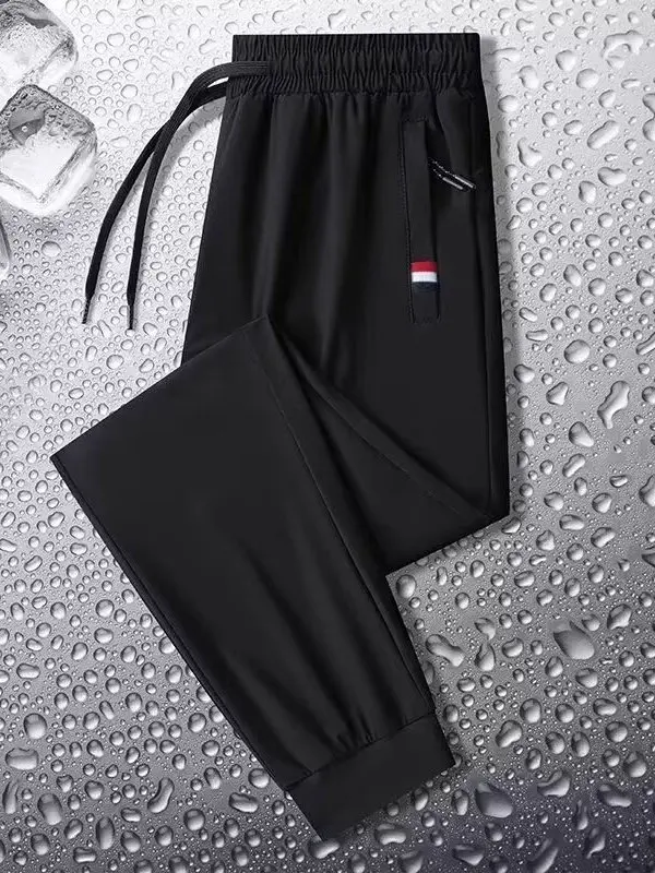 

Men's Ice Silk Pants Summer New Sle Sports Breathable Casual Nine Points Long Pants Thin Polyester Cosite Fiber