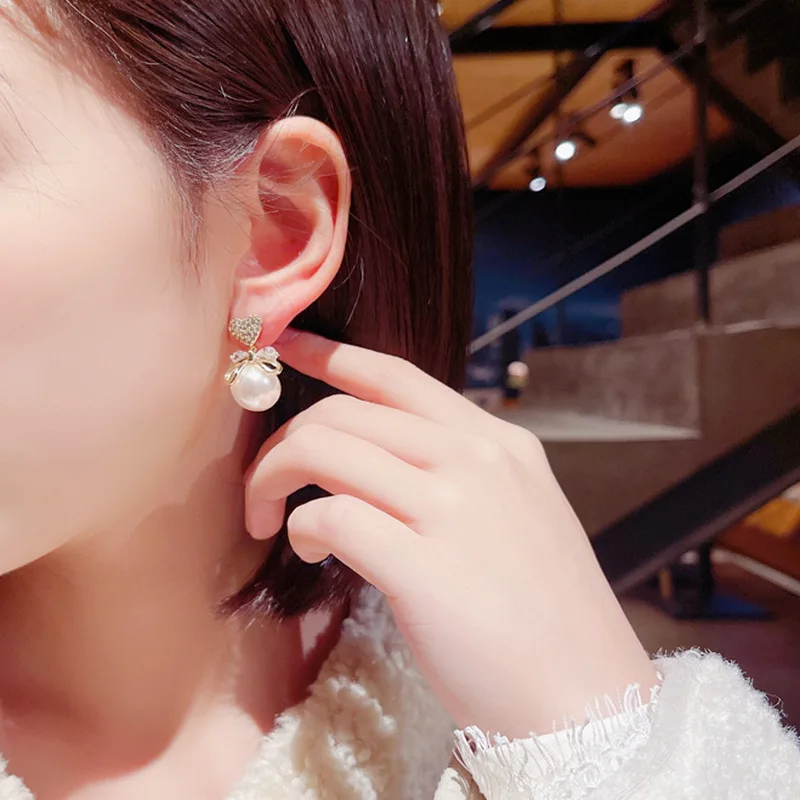 Sweet Earring Manufacturers Sell Korean Version New Fashionable And Versatile Crystal Peach Heart Bow Pearl Elegant Earrings