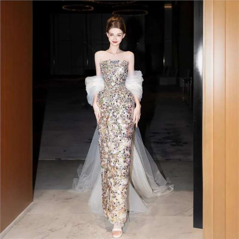 

The toasting party will feature sequined candy-colored adult dresses