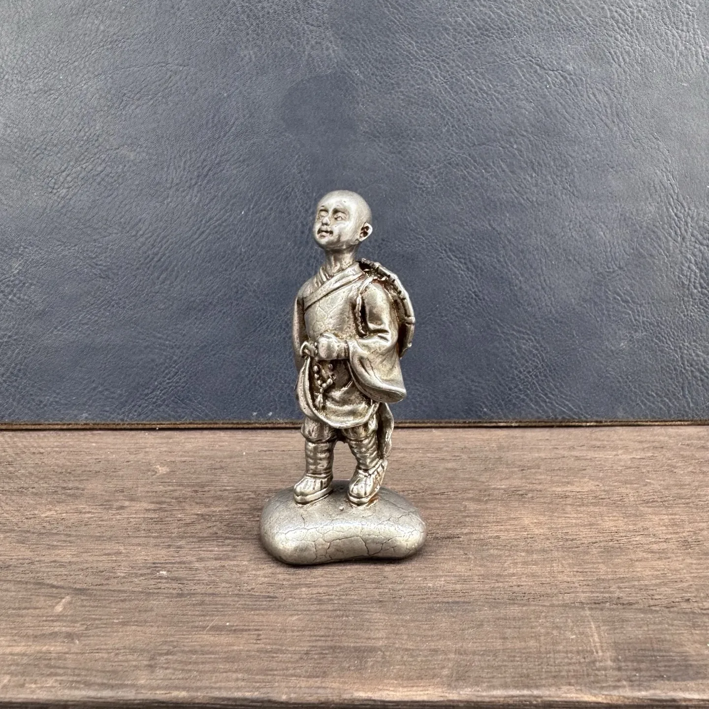 

A Chinese retro ironwork carved little monk desk ornament for home decoration