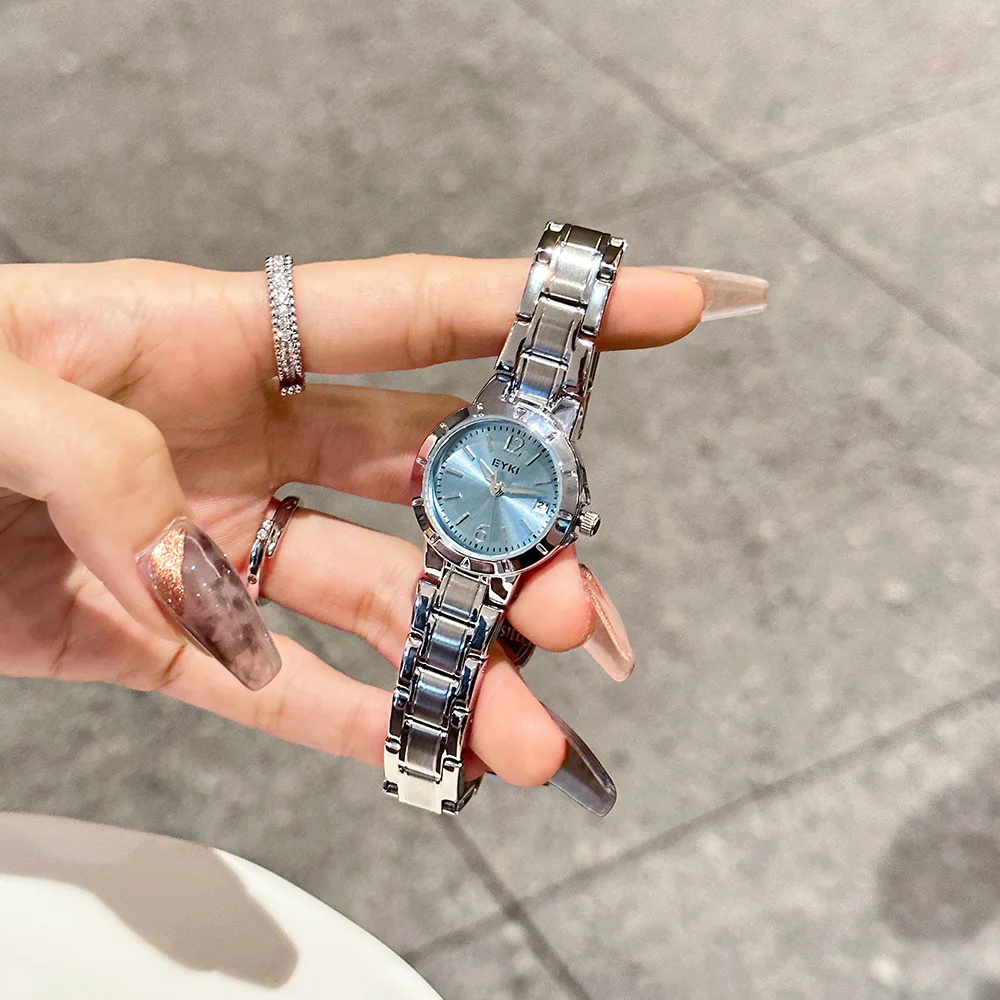 New stylish and elegant women's wristwatch with date display, featuring a stainless steel strap and quartz movement.