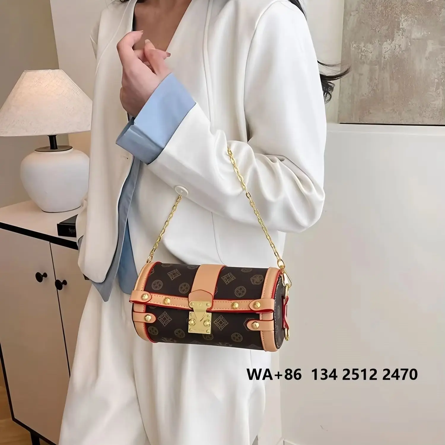 Vintage letter print mini barrel bag with brown leather trim and clasp, removable thin gold chain strap, a retro-style crossbody/shoulder bag for women.