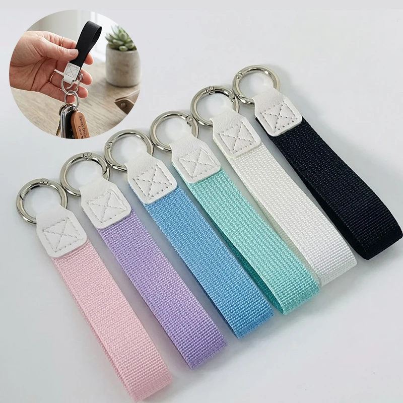 Llavero de Muñeca de Nailon y Cuero con Argolla Plateada (Estilo Minimalista) S6ed8a79fd1684792aa319654ec2ad094Y