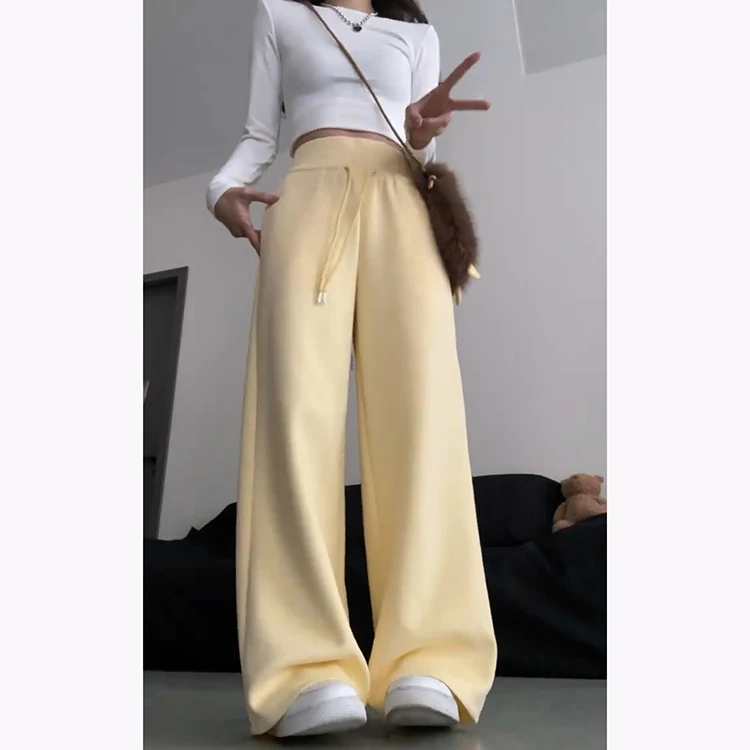 กางเกงฮาเร็มลำลองสีเหลืองนมสำหรับผู้หญิง ฤดูใบไม้ผลิ-ฤดูร้อน 2025 รุ่นใหม่ ช่วยลดเลือนริ้วรอย ทรงหลวมพลิ้ว ช่วยให้ดูผอมเพรียว ทรงกระดิ่ง แฟชั่นเกาหลี...