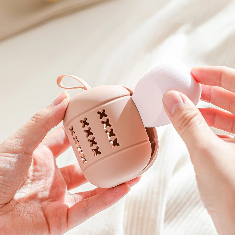 ポータブルシリコン収納バッグ,メイクアップスポンジ,エアクッション,ボックス,美容卵,透かし彫り,吊り下げデザイン,旅行