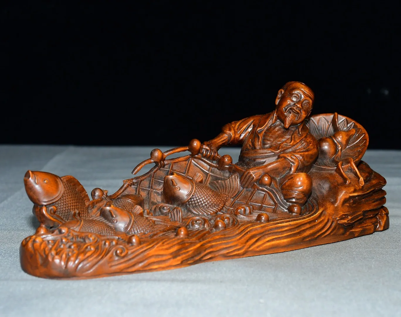 Old Boxwood fisherman fishing by boat return with a full load May there be abundance year after year  Amass wealth Ornament