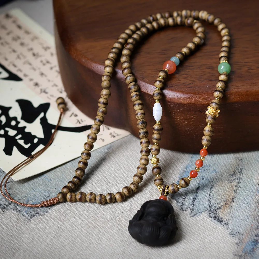 

"Premium butter-like agarwood hand-woven necklace, cultural sandalwood bracelet, and formless Buddha sweater chain"
