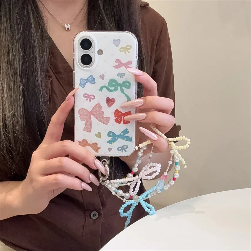 Custodia per telefono Bowknot di colore coreano di moda per iPhone 17 Pro 16 15 14 Pro Max Cover posteriore con cinturino a catena Simpatico cartone animato protettivo C