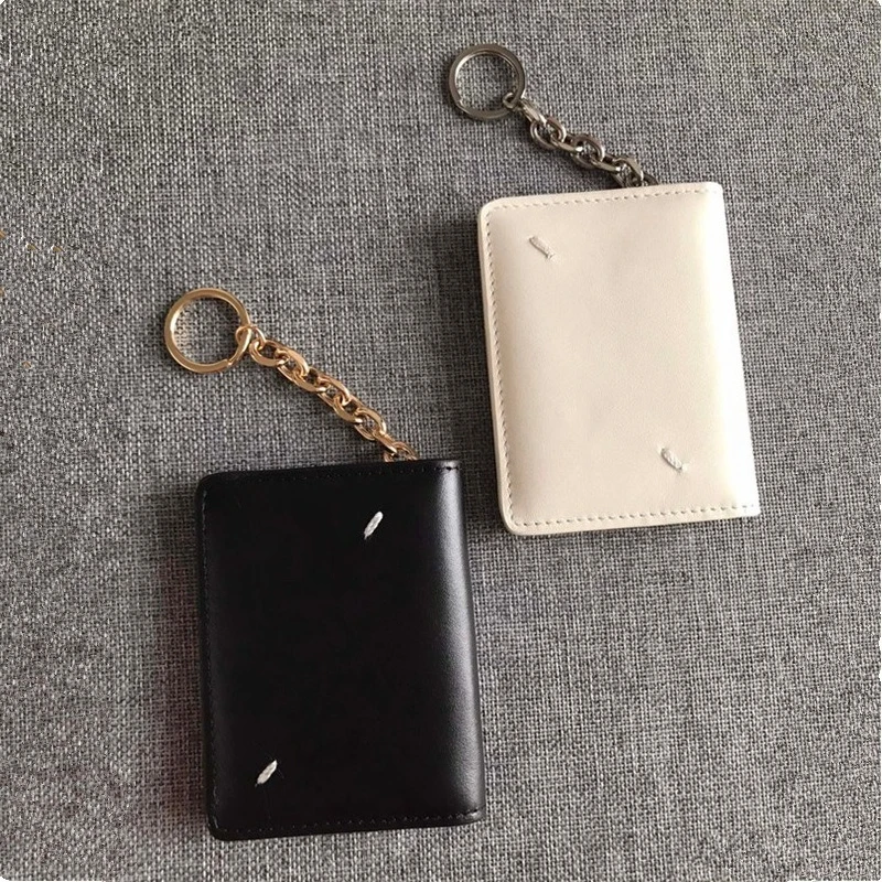 First layer cowhide black and white two-color keychain hanging bag, minimalist and versatile leather portable card bag, key bag.