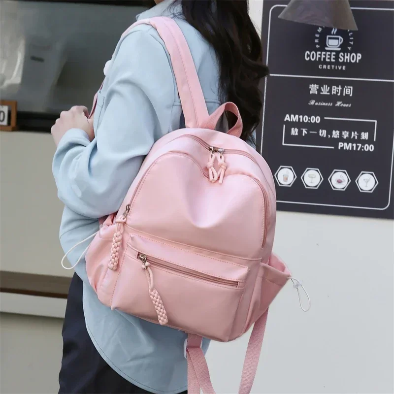 Mochila de Color sólido para mujer, superventas, cremallera de nailon, nuevo bolso de viaje con hilo de coser, mochila escolar juvenil de alta calidad 2024