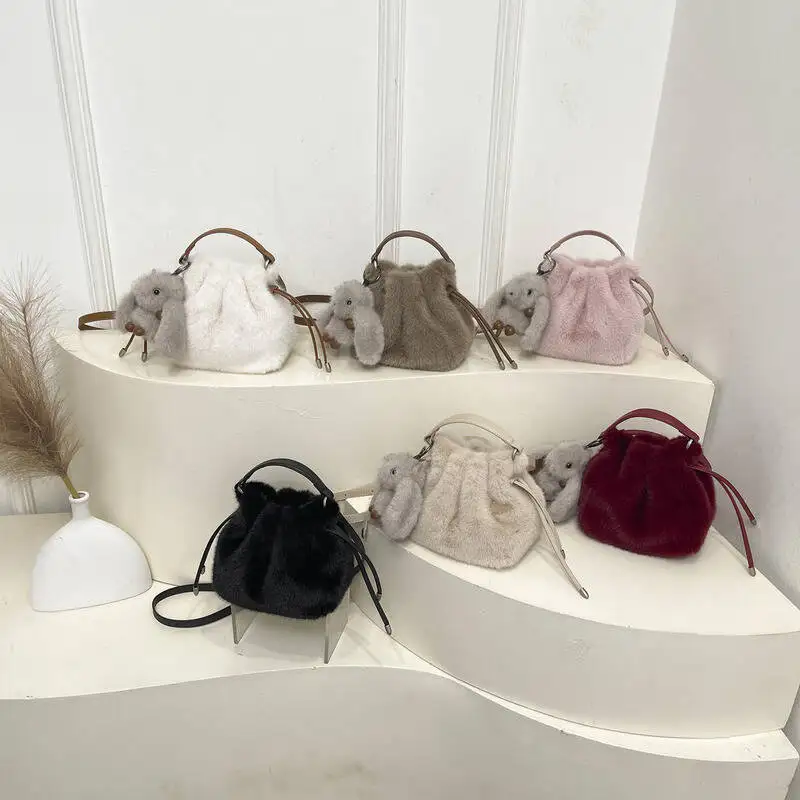 

Faux Fur Bucket Bag with Rabbit Plush Charm Drawstring Closure Detachable Shoulder Strap Fashion Small Handbag for Daily Casual