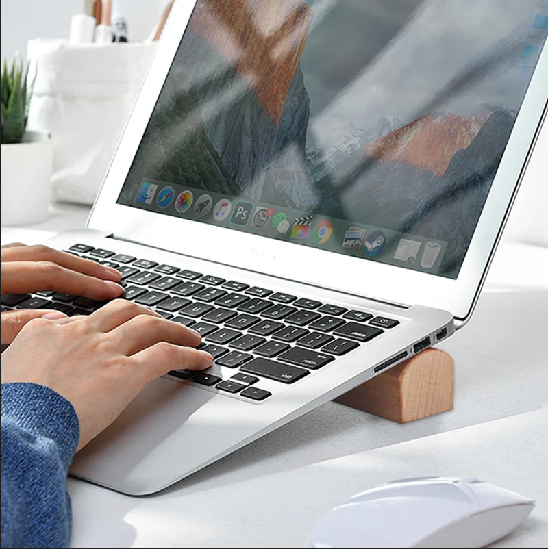 Solid wood notebook stand can be raised. The Macbook Air Pro accessory cooling base is convenient