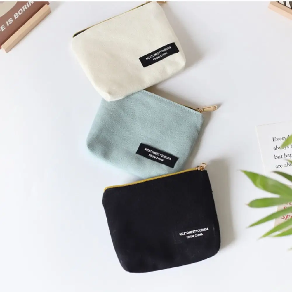 Mini monedero de estilo coreano para mujer, bolsa de cosméticos de lona de Color sólido, bolsa de servilleta sanitaria