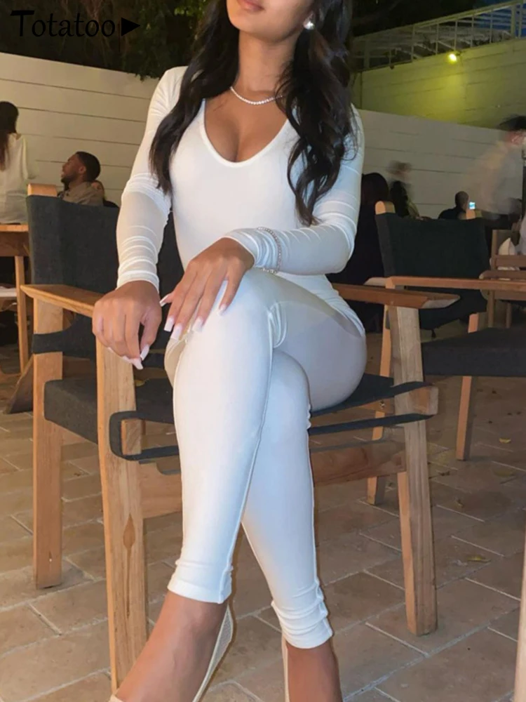 จั๊มสูทรัดรูปแขนยาวสำหรับผู้หญิง ฤดูใบไม้ร่วง ฤดูหนาว ปี 2026 เหมาะสำหรับงานปาร์ตี้ สไตล์เซ็กซี่ คอต่ำ ทรงเข้ารูป