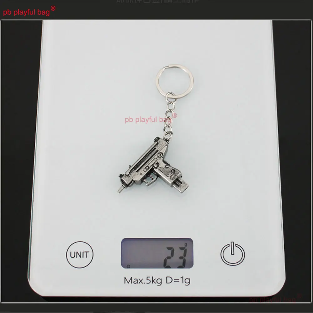 5cm Mini UZI arma de juguete modelo llavero colgante llavero de Metal extraíble decoración manualidades juego figura de acción regalos para niños ZG397