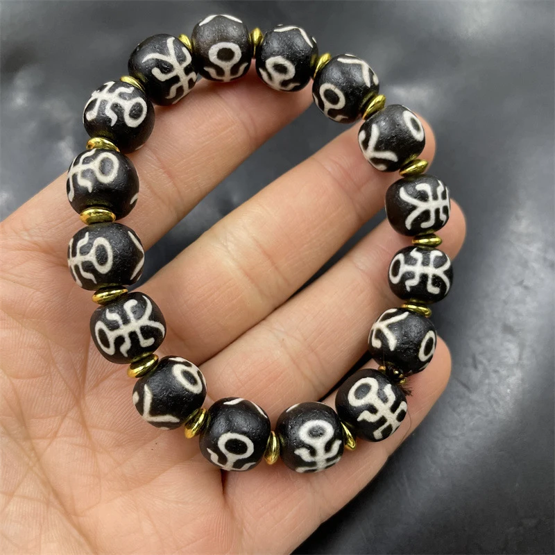 

Винтажный черно-белый браслет из тибетских бусин-абакусов и старинного агата