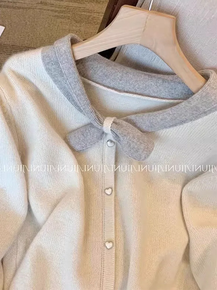 Maglione lavorato a maglia di lusso di moda di alta qualità Vintage con scollo a v manica lunga pullover bianchi Office Lady Chic autunno inverno