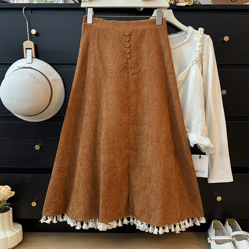 

Коричневые вельветовые плиссированные юбки трапециевидной формы, дизайн на пуговицах, с кисточками, подол, эластичная талия, женская юбка, осенняя мода, универсальные юбки