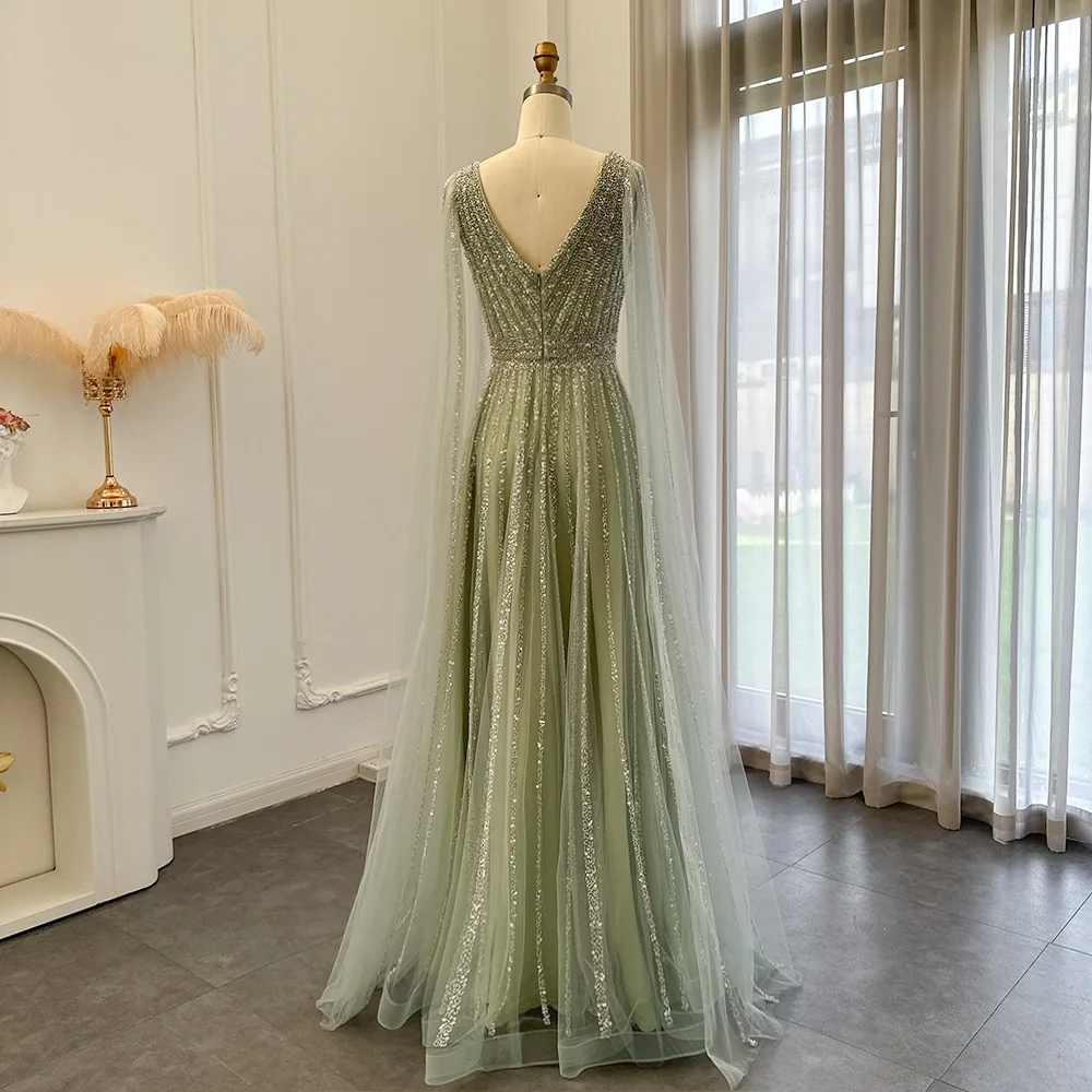 شارون سعيد فساتين سهرة فاخرة باللون الأزرق في دبي مع أكمام كيب فستان حفلات عربي أخضر عاري للنساء لحفلات الزفاف SS322 مخصص