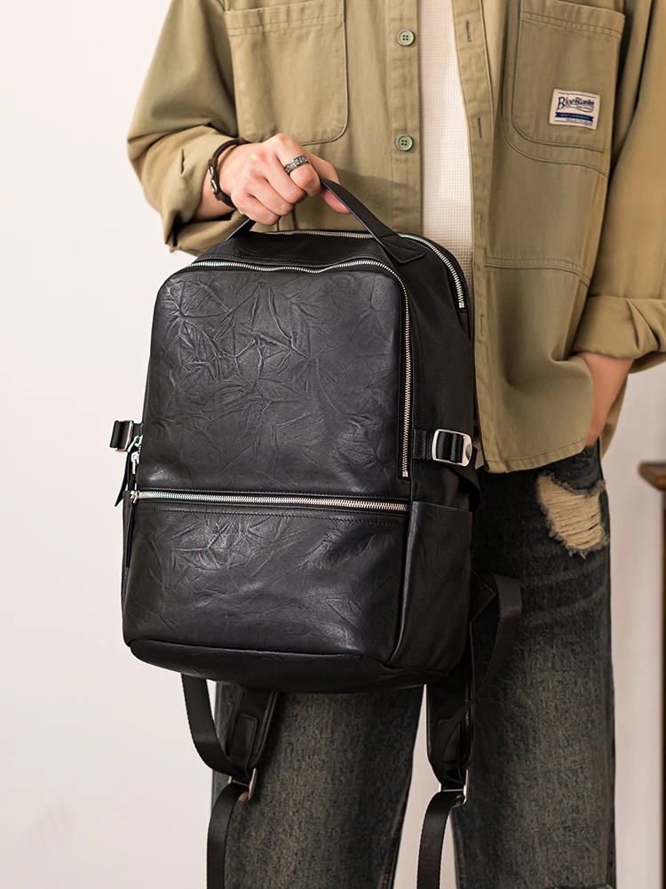 PNDME outdoor travel high quality genuine leather men's black backpack fashion casual luxury cow leather computer bagpack