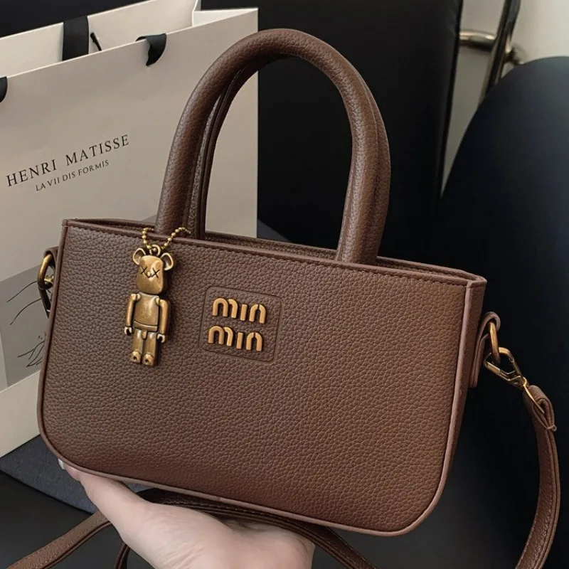 This year's fashion trend is high-end hand-held small bags for women 2025 new simple hand-held shoulder crossbody bags and small