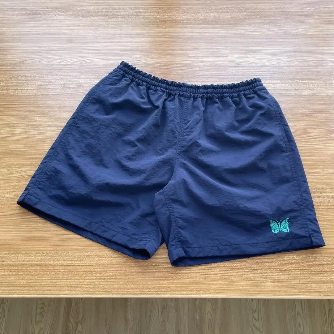 Benodigdheden AW vlinder geborduurd paar, retro losse rechte strand casual sneldrogende shorts, ultradun