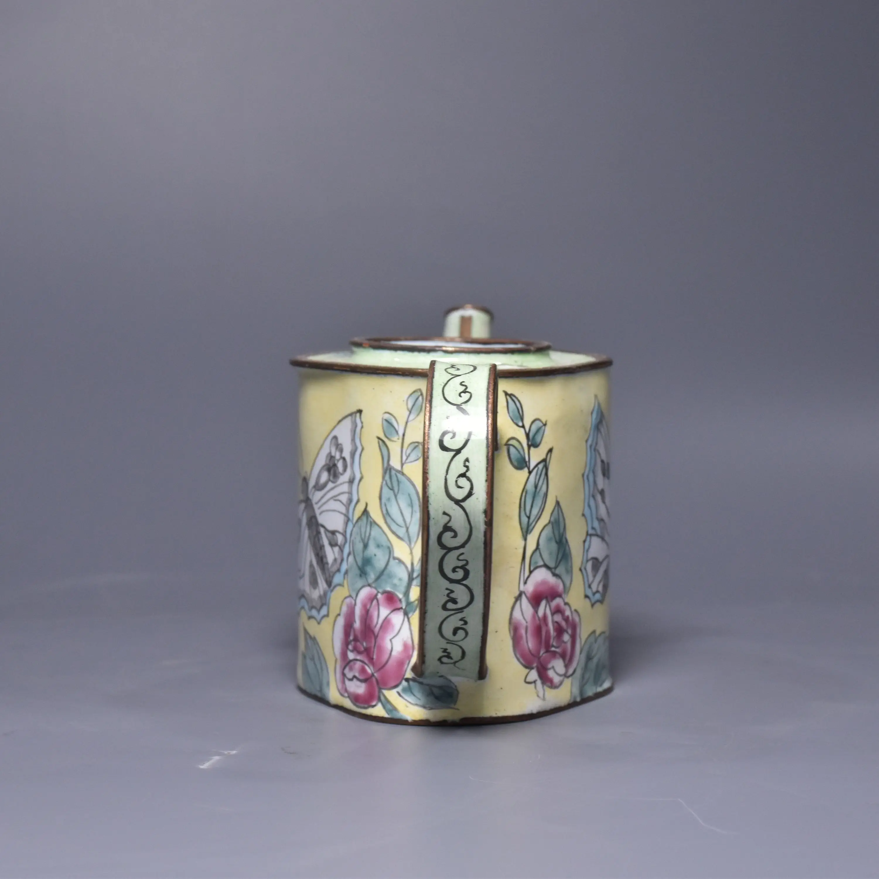 The antique hand-painted copper A vase made of purple copper base with cloisonné enamel depicting peonies and butterflies.