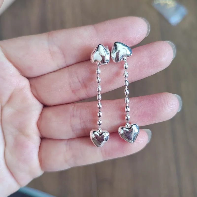 

Новые модные серьги-сердечки с кисточками 2026 года, идеально подходят для повседневного стиля