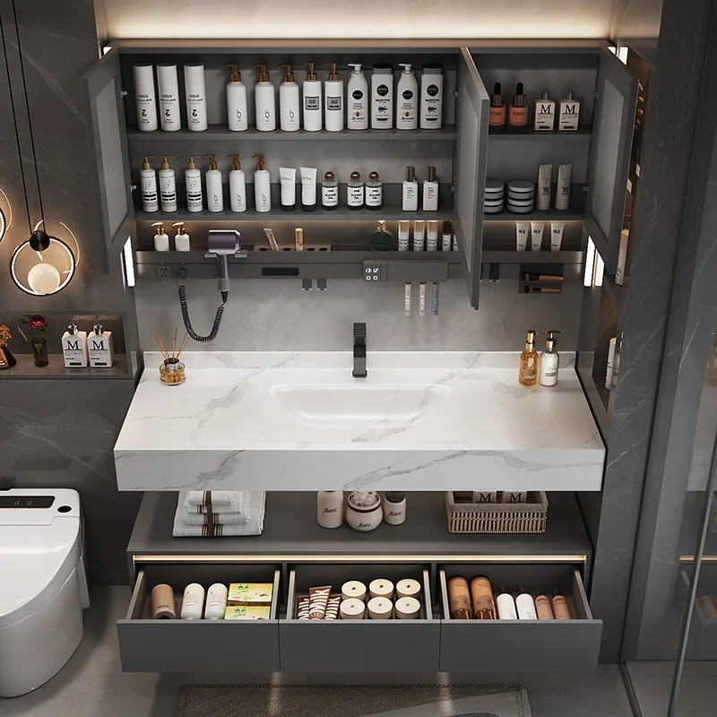 

Комплект мебели для ванной комнаты: тумба с интегрированной раковиной из гнутого влагостойкого материала, унитаз, раковина для стирки, умывальник, тумба-раковина.