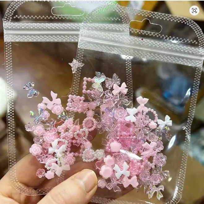 100pcs/200PCS 3D Pink White Bow/Flower Nail Art Charms Pearl Star Heart , Aurora Ribbon Nail Rhinestones Resin Nail Craft Dec