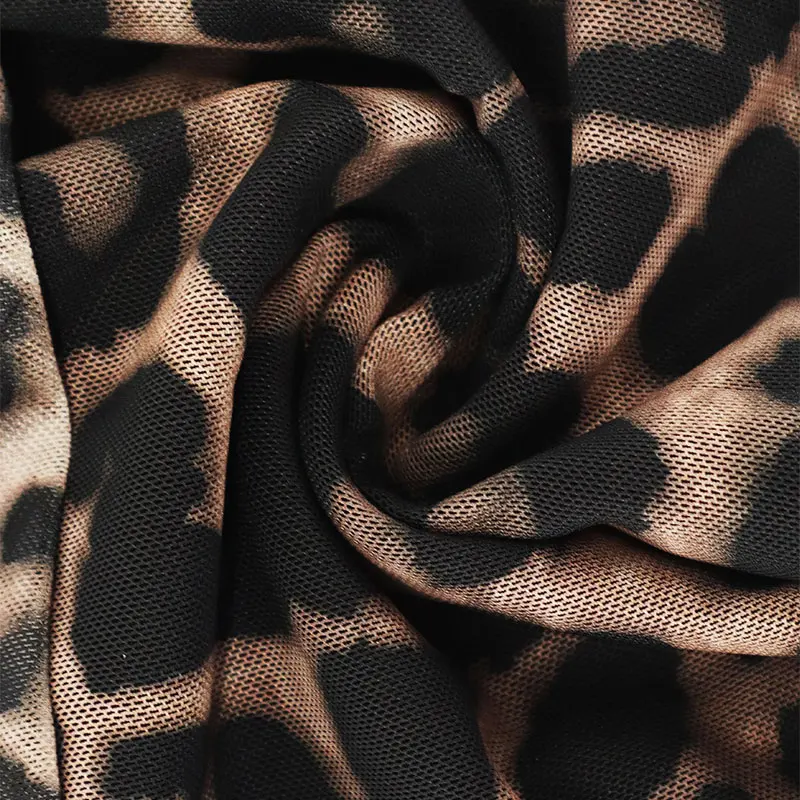 T-shirt da donna autunno nuovo streetwear moda maniche lunghe o-collo magliette sexy leopardo backless femminile versatile abbigliamento lavorato a maglia