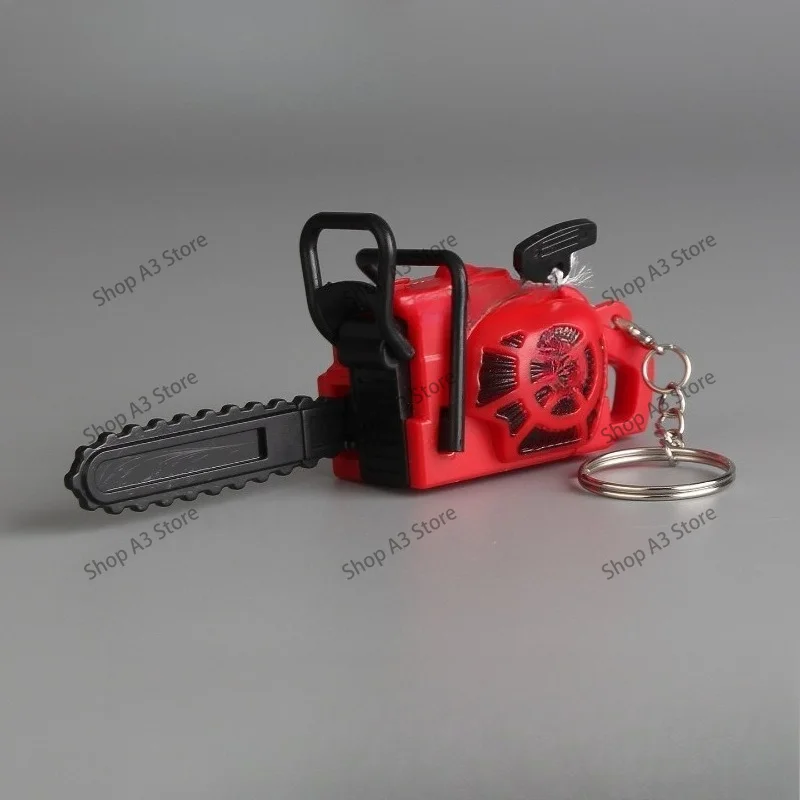 Bored, saw and saw! Pull the rope, movable chainsaw model, toy, creative keychain, backpack, small pendant.