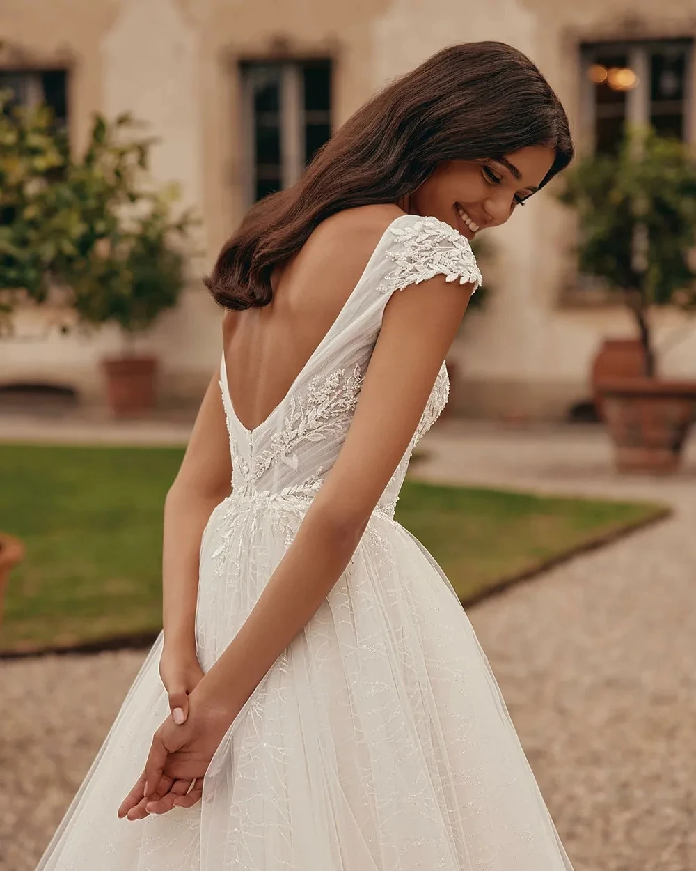 Eleganti abiti da sposa per le donne Sexy abito da sposa Appliques di pizzo Backless senza maniche profondo scollo a v Vintage Robe Vestidos De Novia