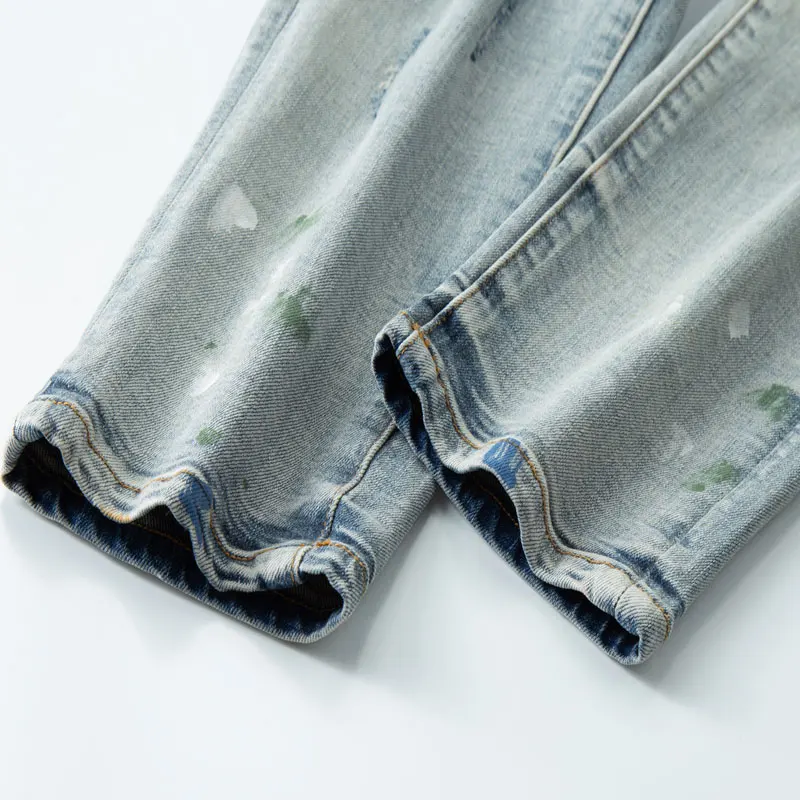 Fashionable new men's jeans stretch slim fit perforated patch washed blue jeans designer high street hip-hop brand pants