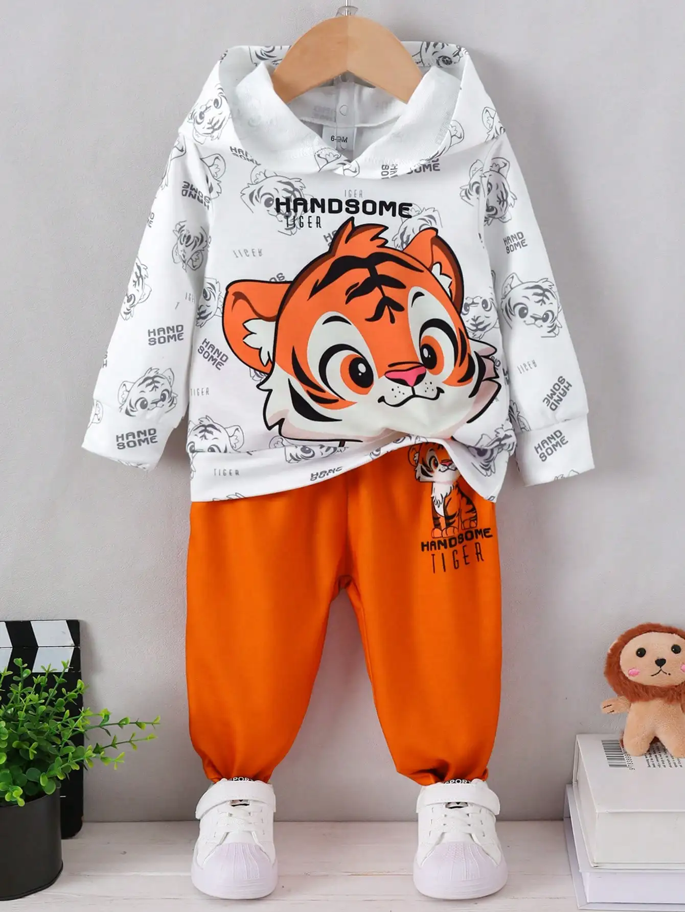 Baby Boy's Spring and Autumn Cartoon Tiger Print Hooded Two-Piece Set, Featuring a Stylish Cartoon Tiger Head Print All Over, Long-Sleeved Hooded Sweatshirt Paired with Jogger-Style Casual Pants